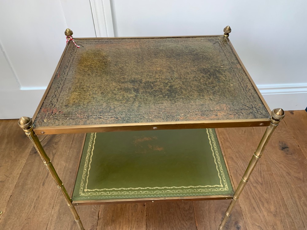 A two-tier brass occasional table featuring faux-bamboo legs, corner finials, and green leather surfaces with gold leaf tooling. View II