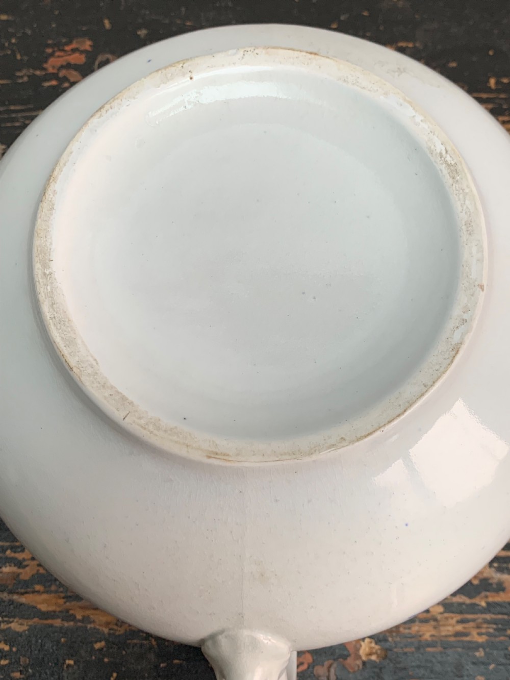 A bulbous white ceramic jug featuring transfer-printed blue flying cranes, a crackle glaze finish, and a moulded handle. View XI