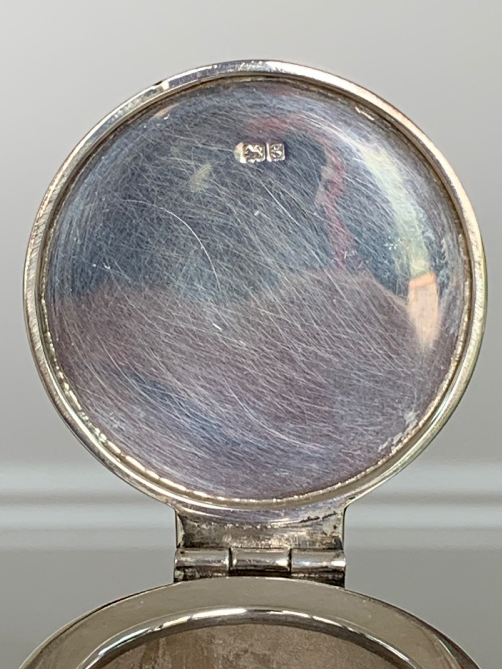 An Edwardian clear glass claret jug featuring wheel-engraved daisy motifs and a hallmarked sterling silver collar with handle. View IX