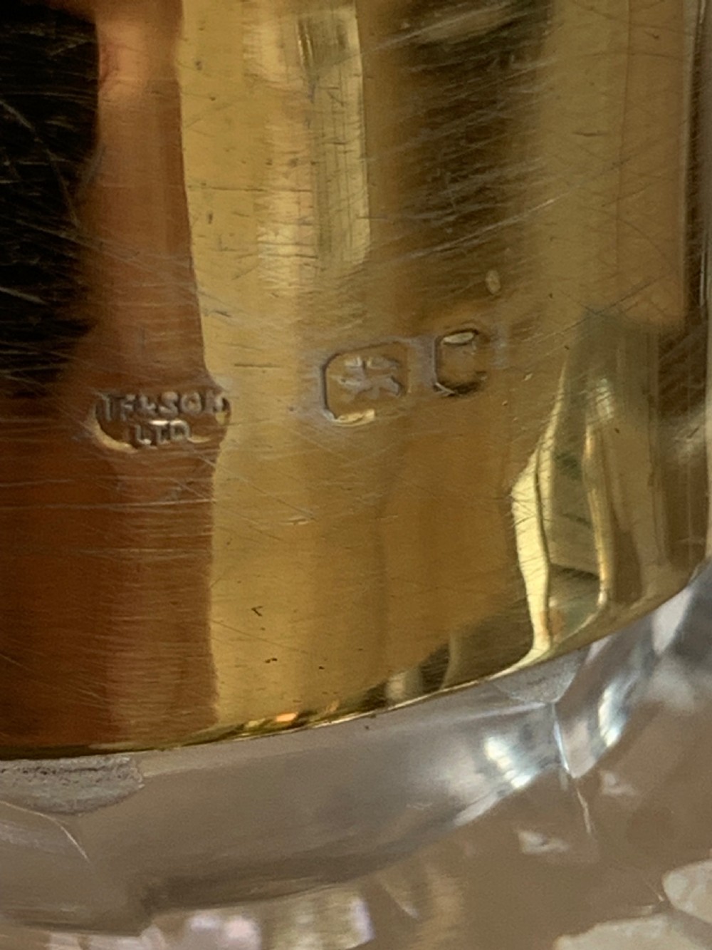 A square clear crystal brandy decanter featuring a silver-gilt collar around the neck, a crowned N monogram on the body, and a rectangular stopper. View VI
