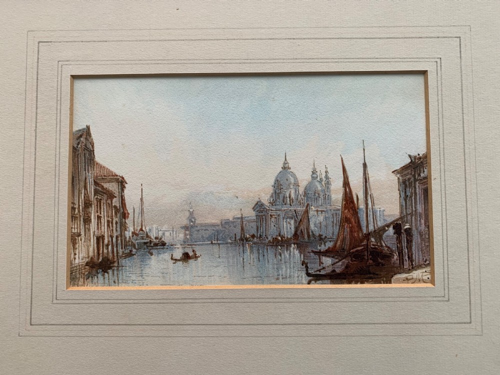 An antique watercolour painting on paper depicting a canal scene with boats and architectural domes in muted blue and brown tones.