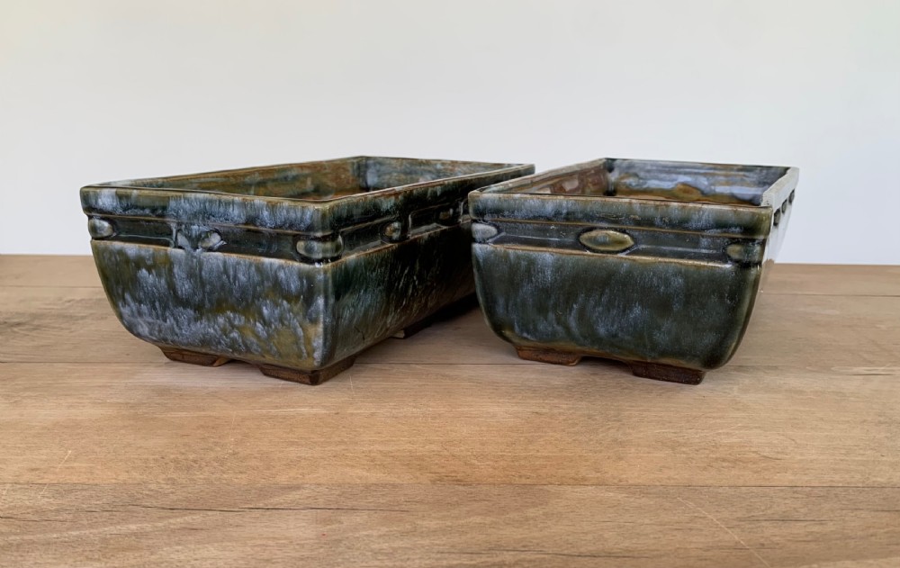 A pair of rectangular stoneware bonsai planters featuring a mottled olive-green drip glaze and embossed beaded rim details. View II