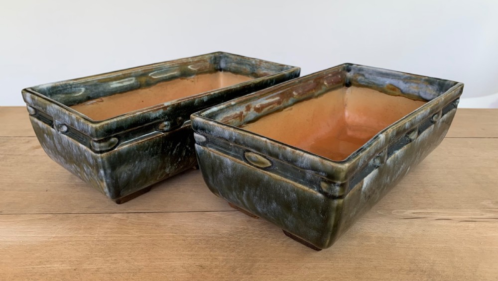 A pair of rectangular stoneware bonsai planters featuring a mottled olive-green drip glaze and embossed beaded rim details. View III