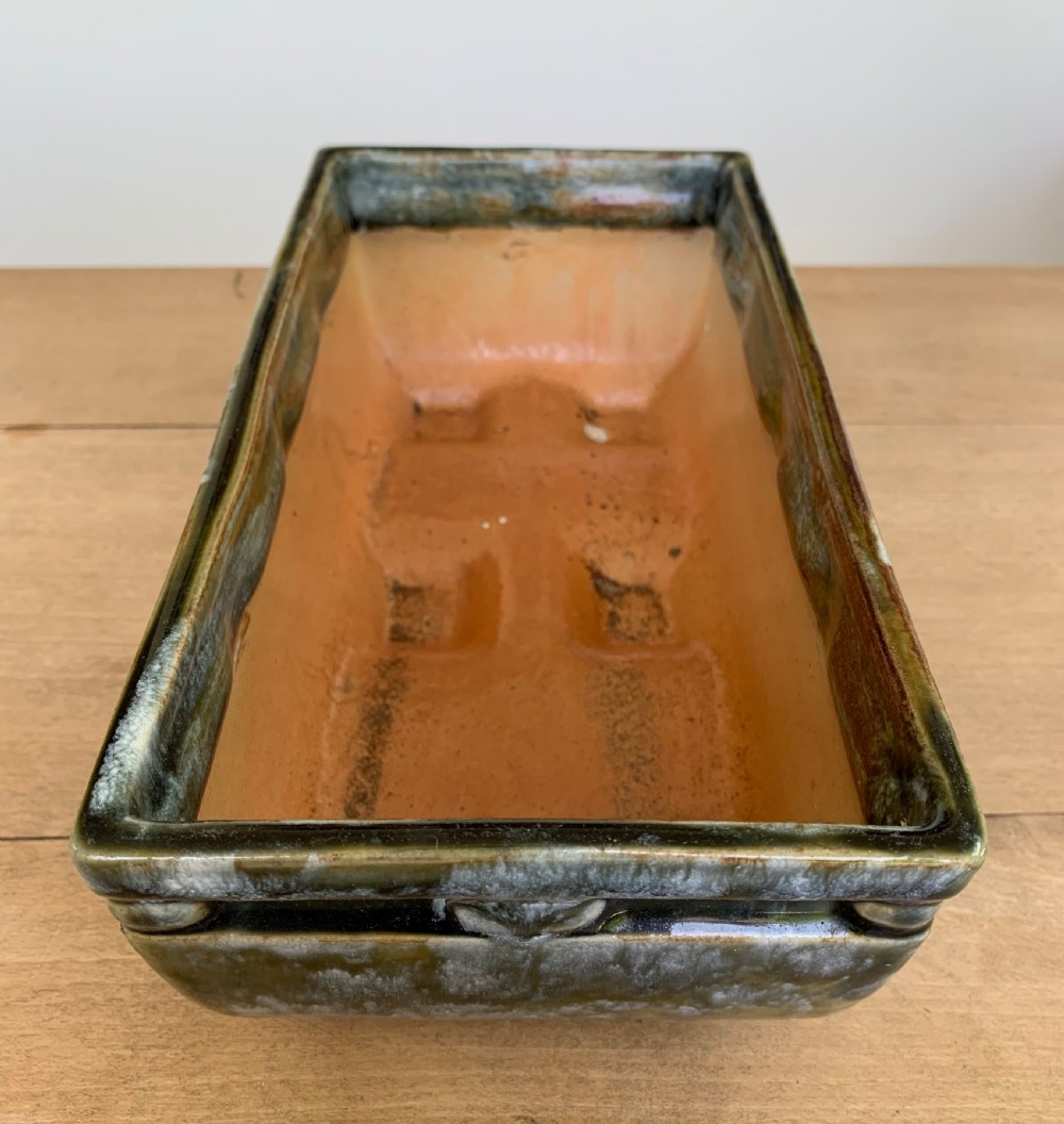 A pair of rectangular stoneware bonsai planters featuring a mottled olive-green drip glaze and embossed beaded rim details. View X