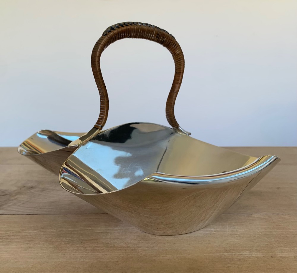 A late Victorian silver-plated twin bon-bon dish with scoop-shaped bowls and a central overhead cane-wrapped arch handle. View III