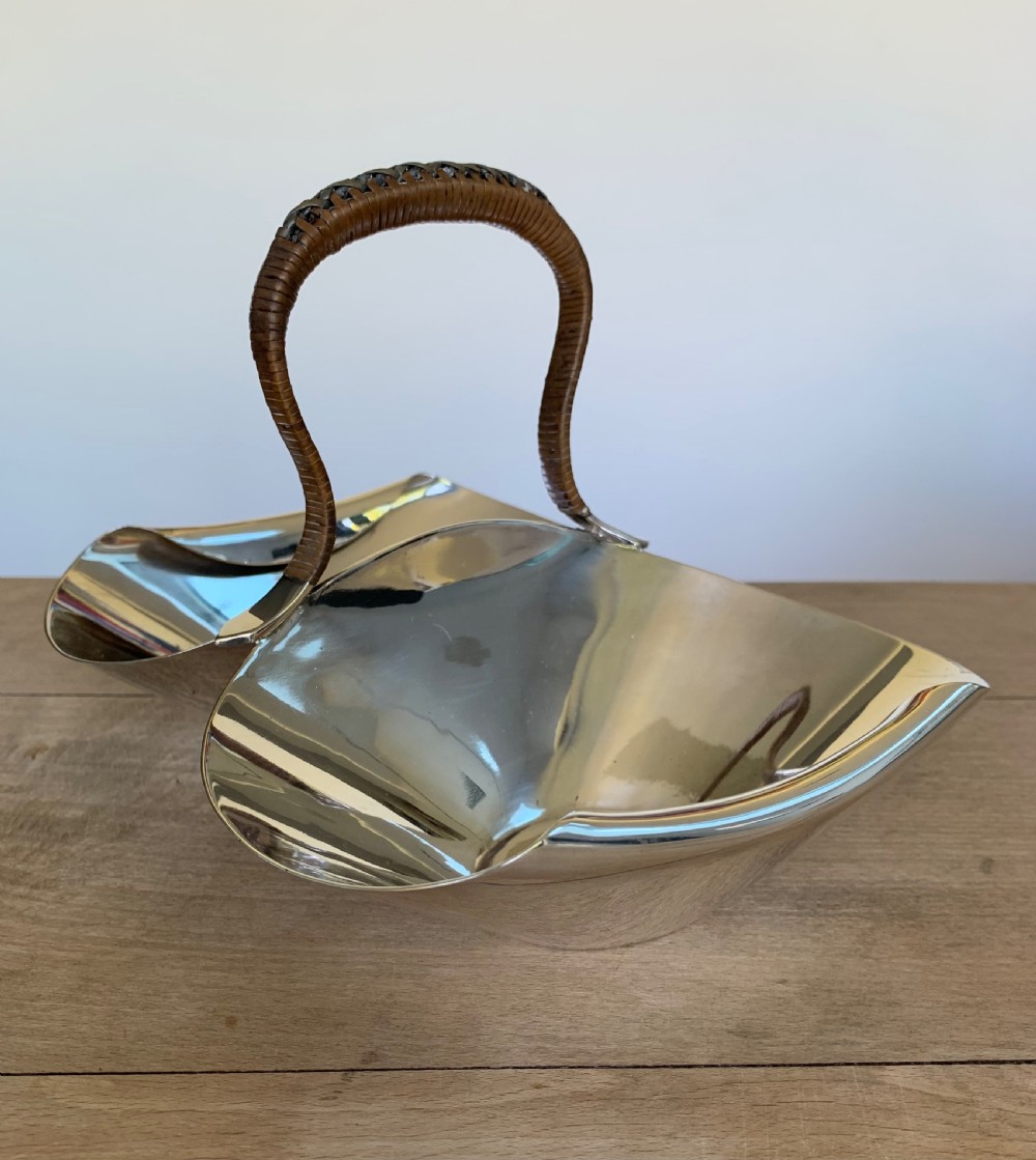 A late Victorian silver-plated twin bon-bon dish with scoop-shaped bowls and a central overhead cane-wrapped arch handle. View IV