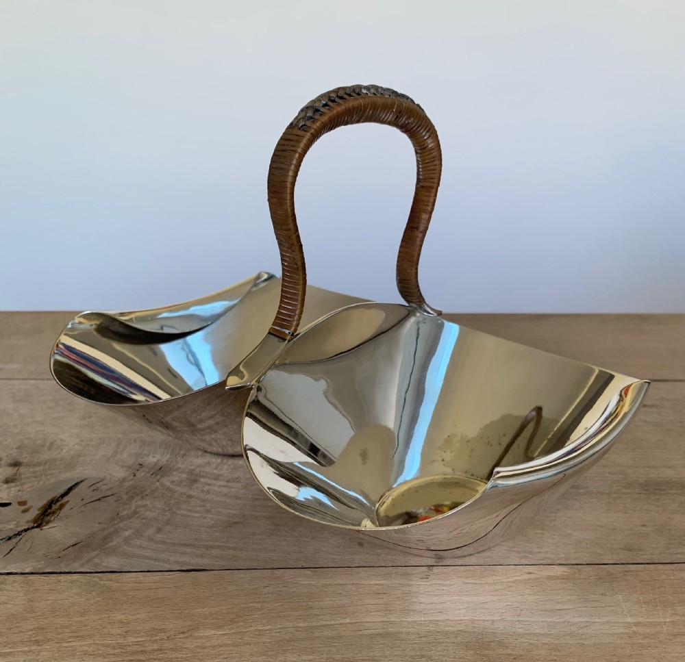 A late Victorian silver-plated twin bon-bon dish with scoop-shaped bowls and a central overhead cane-wrapped arch handle. View V