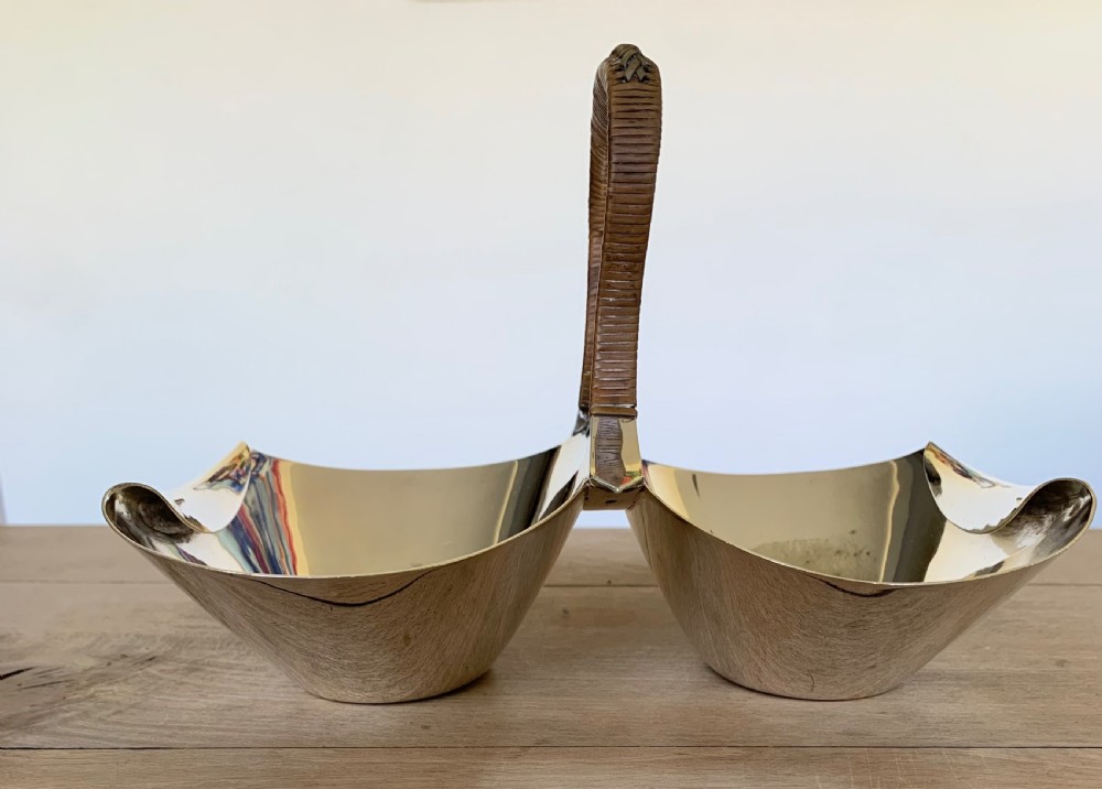 A late Victorian silver-plated twin bon-bon dish with scoop-shaped bowls and a central overhead cane-wrapped arch handle. View VI