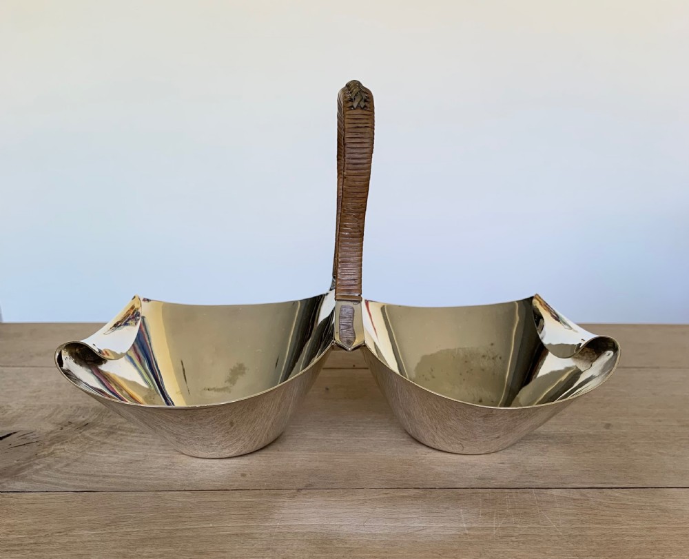 A late Victorian silver-plated twin bon-bon dish with scoop-shaped bowls and a central overhead cane-wrapped arch handle. View VII