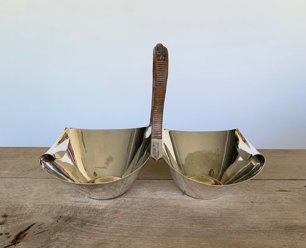 A late Victorian silver-plated twin bon-bon dish with scoop-shaped bowls and a central overhead cane-wrapped arch handle. View VIII