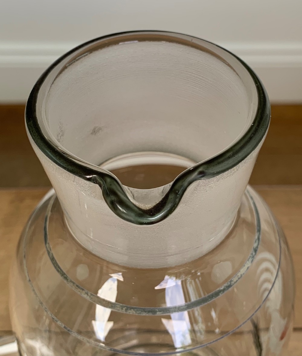 A clear glass Art Deco cocktail shaker featuring a ground glass neck, silver painted lines, and a hand-painted white cockerel motif with a red comb. View X