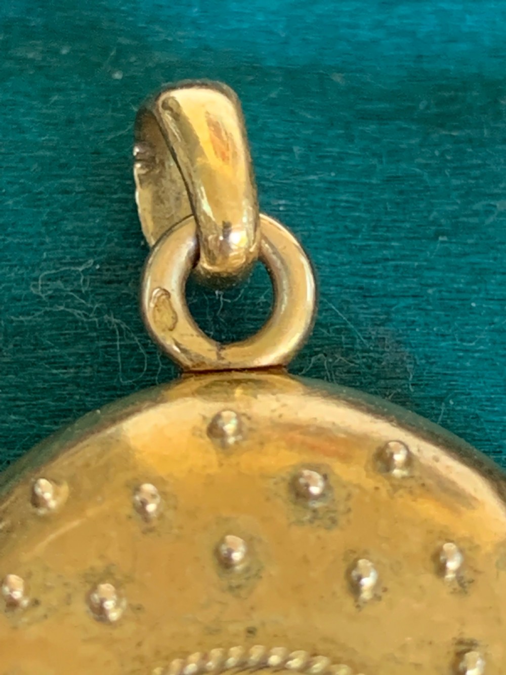 An oval 18ct yellow gold antique photo locket decorated with beaded granulation and a central turquoise and pearl target cluster. View VIII