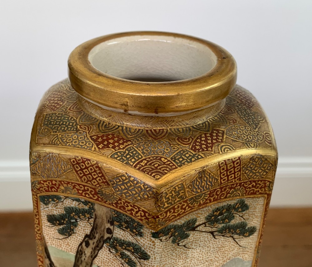 A tall hexagonal Japanese Satsuma ceramic vase with crackle glaze, depicting detailed painted figures in traditional robes and gilded geometric borders. View VII