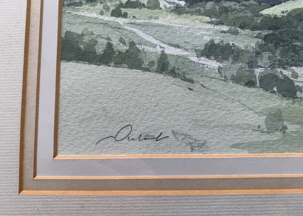 A framed watercolour landscape painting depicting rolling green hills and distant grey mountains near Killin, Scotland, signed by Stanley Orchart. View IV