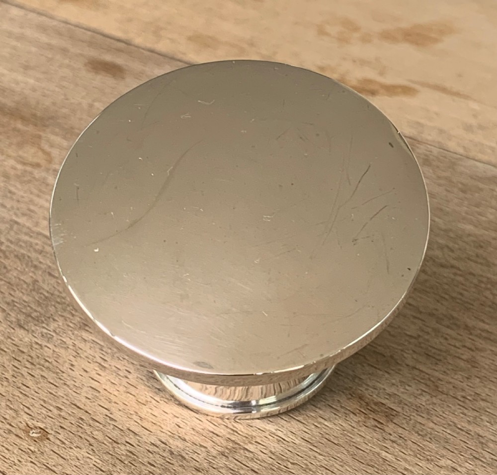A spherical clear cut glass scent bottle featuring diamond patterns and a polished sterling silver neck collar and lid. View VIII