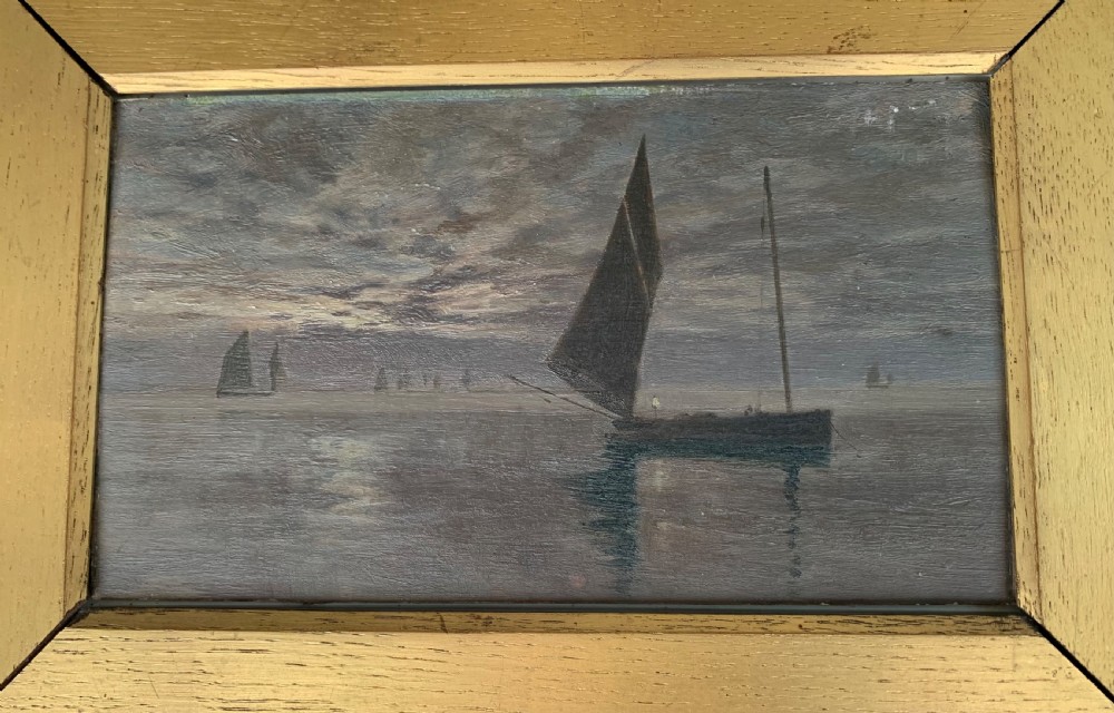A 19th-century oil painting on board depicting sailing vessels on calm waters under an overcast sky, framed in a wide gilt frame. View V