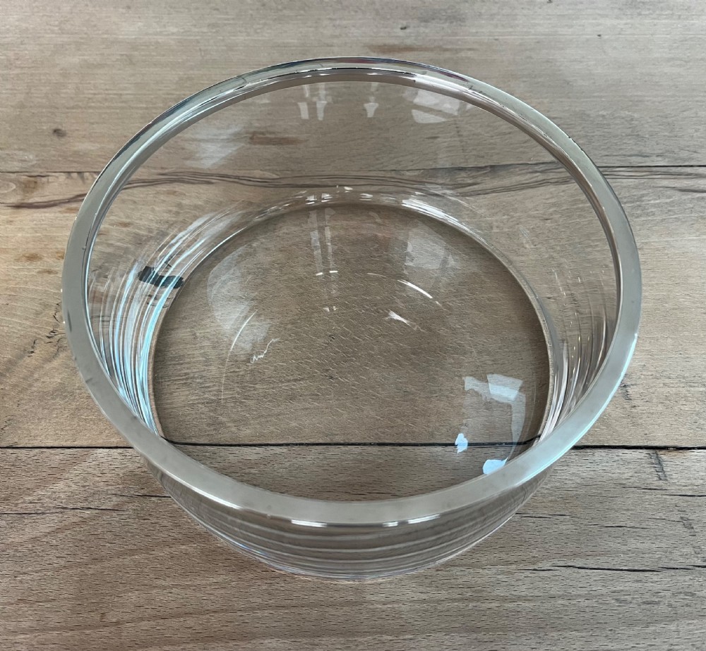 A cylindrical clear glass bowl featuring a smooth polished sterling silver rim around the top edge. View III