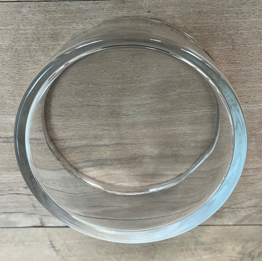 A cylindrical clear glass bowl featuring a smooth polished sterling silver rim around the top edge. View VIII