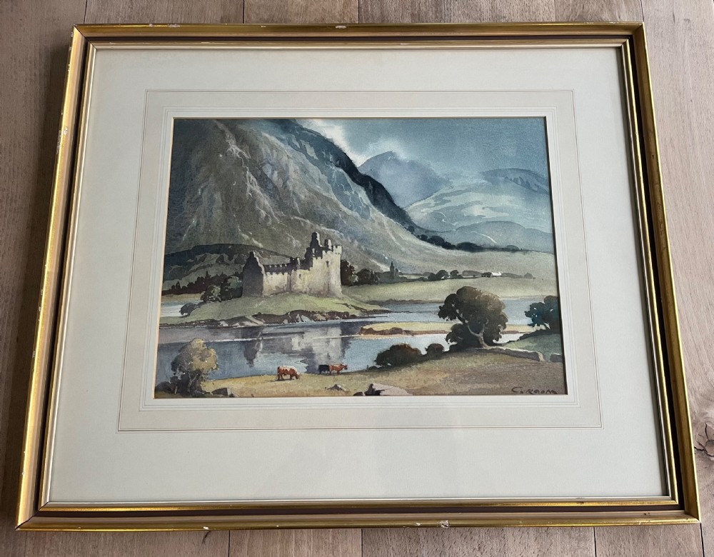 A framed watercolour painting by Emerson H. Groom depicting Kilchurn Castle on the banks of Loch Awe set against a backdrop of mountains. View II