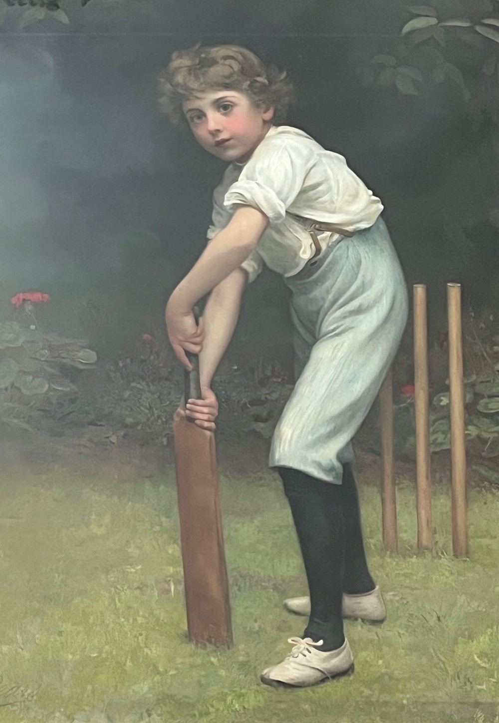 A Victorian chromolithograph depicting a young boy in light blue trousers holding a wooden cricket bat in front of wickets on a green lawn.