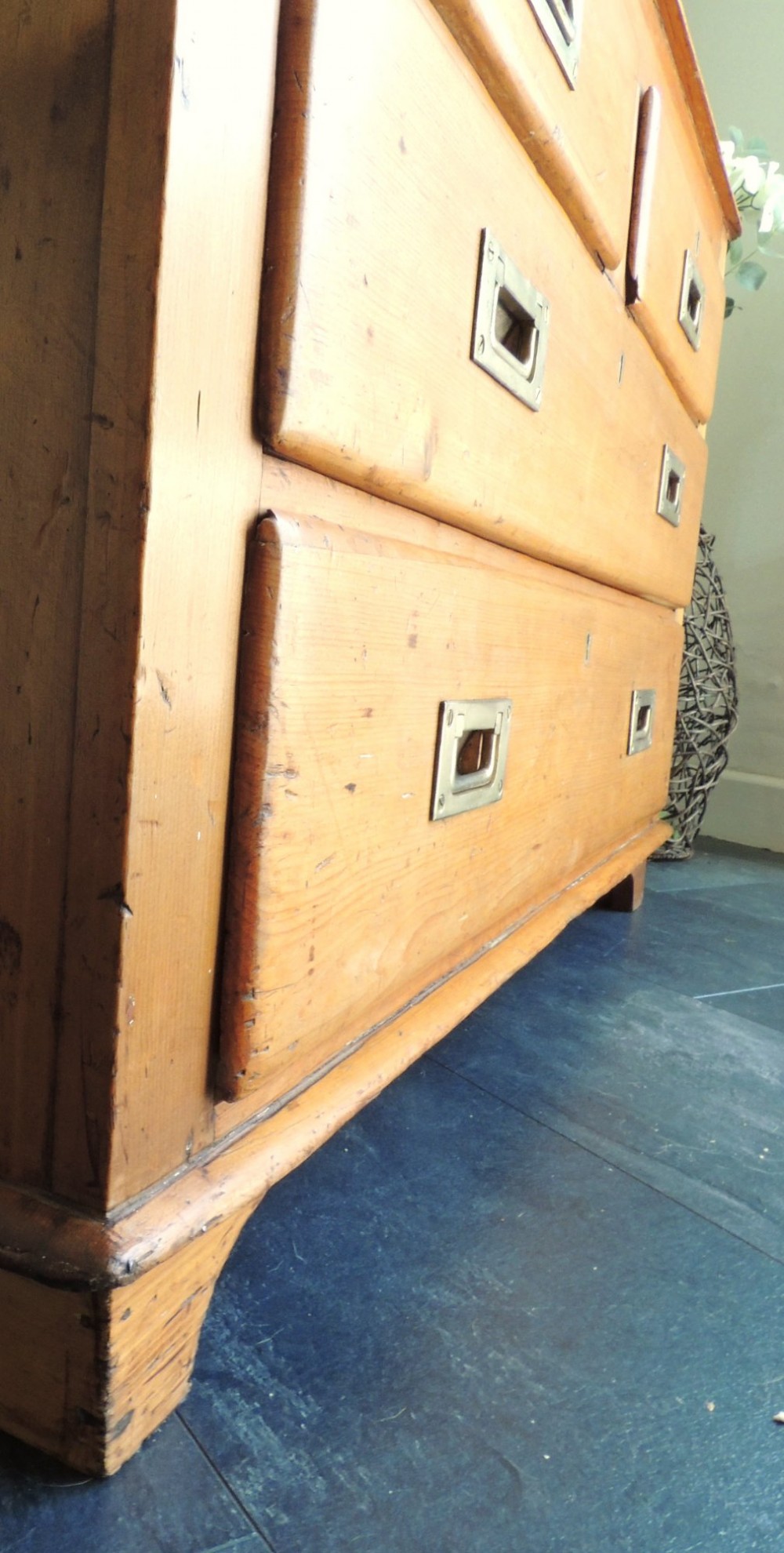 A Victorian solid pine chest of drawers featuring two short drawers over two long drawers fitted with flush brass handles. View IX