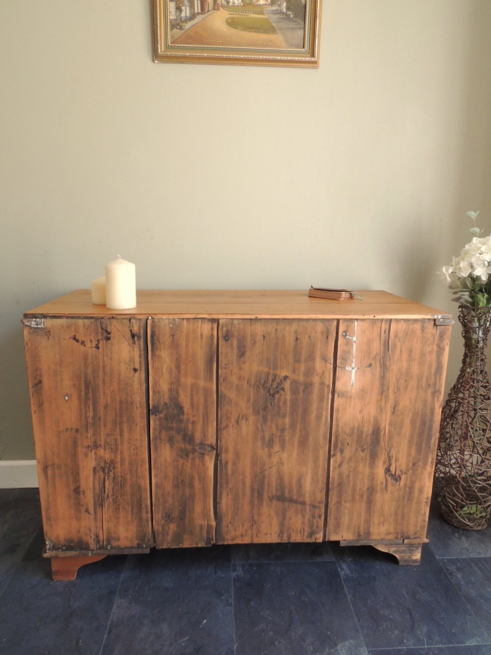 A Victorian solid pine chest of drawers featuring two short drawers over two long drawers fitted with flush brass handles. View XIII