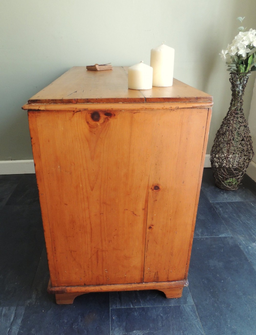 A Victorian solid pine chest of drawers featuring two short drawers over two long drawers fitted with flush brass handles. View XIV