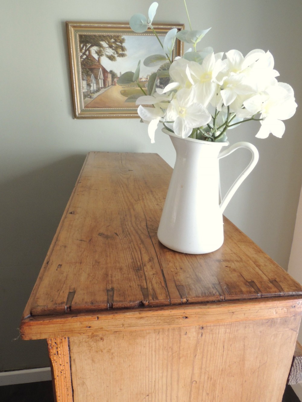 A tall Victorian open-front pine bookcase featuring four spacious shelves and a planked backboard resting on a solid plinth base. View IX