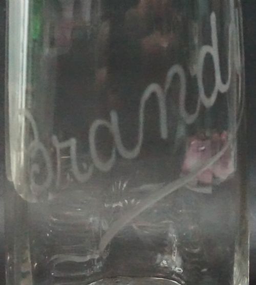 A PAIR OF OPTICALLY BLOWN CRYSTAL GLASS DECANTERS ENGRAVED 'BRANDY' 'WHISKY' JAMES POWELL LONDON C1900 - ADDITIONAL PHOTO 1