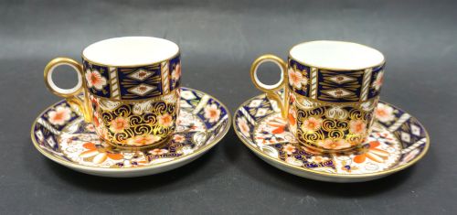 A Pair of Royal Crown Derby Coffee Cans and Saucers 1921 & 1924