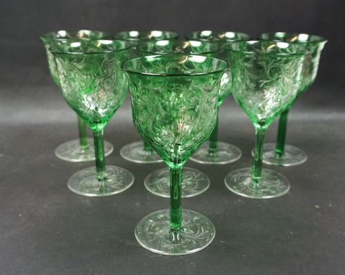 A Set of Eight Intaglio Engraved Green Wine Glasses, Stevens & Williams. English C.1910