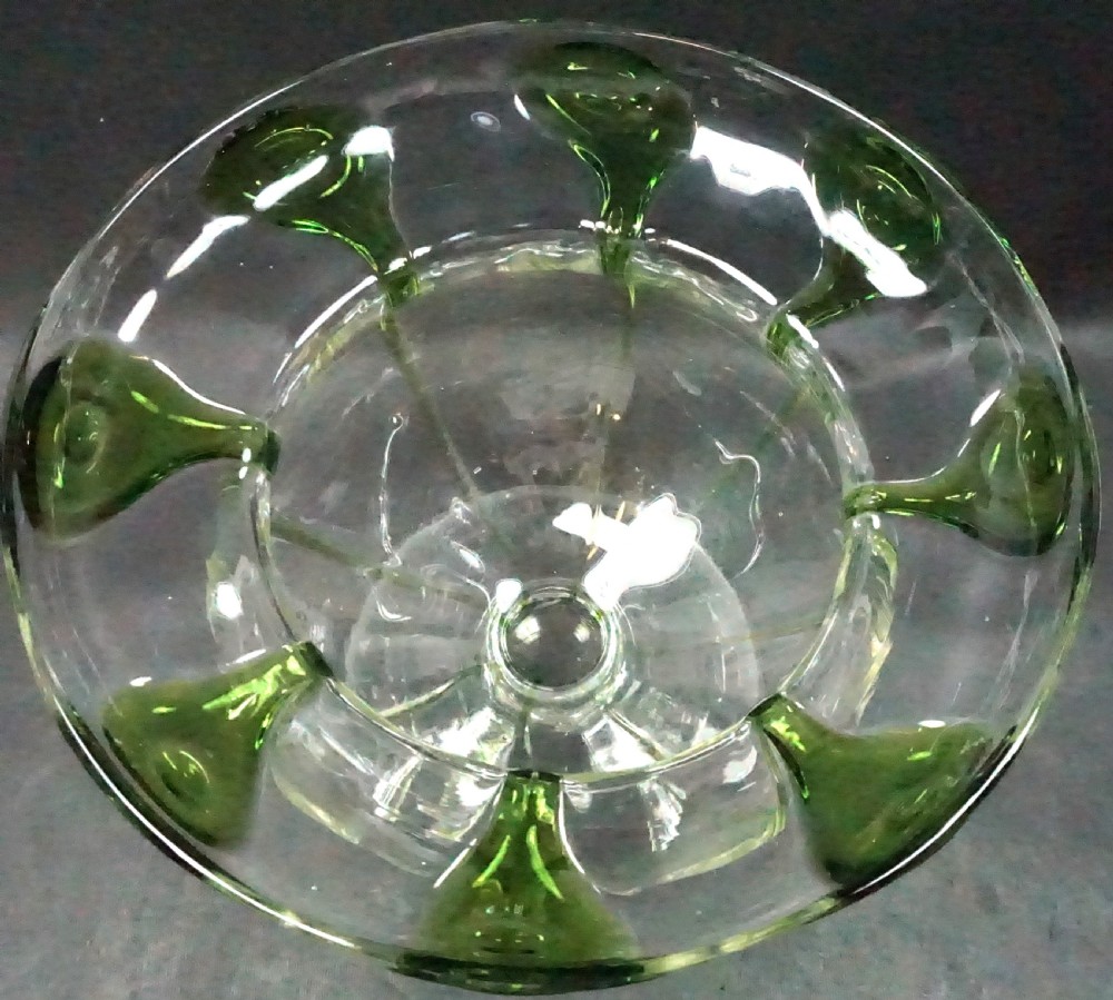 A late nineteenth-century hand-blown clear crystal footed vase featuring a flared rim decorated with applied green glass peacock-eye motifs. View II