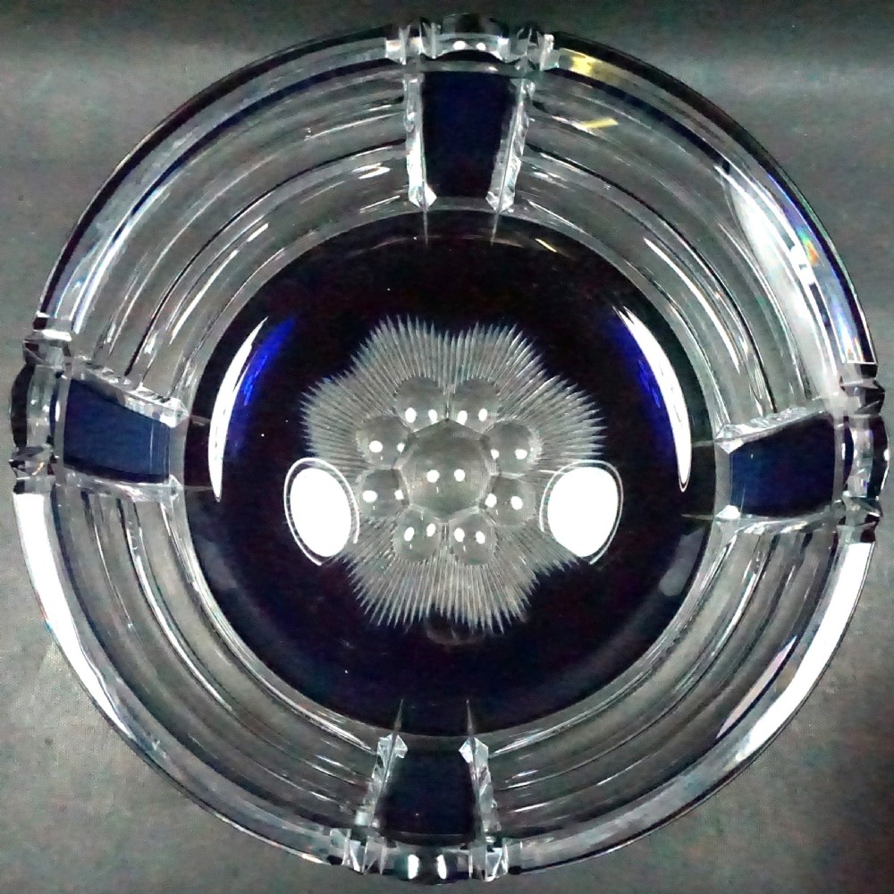 A circular Art Deco lead crystal bowl featuring a cobalt blue overlay cut with horizontal lines and vertical geometric facets. View II