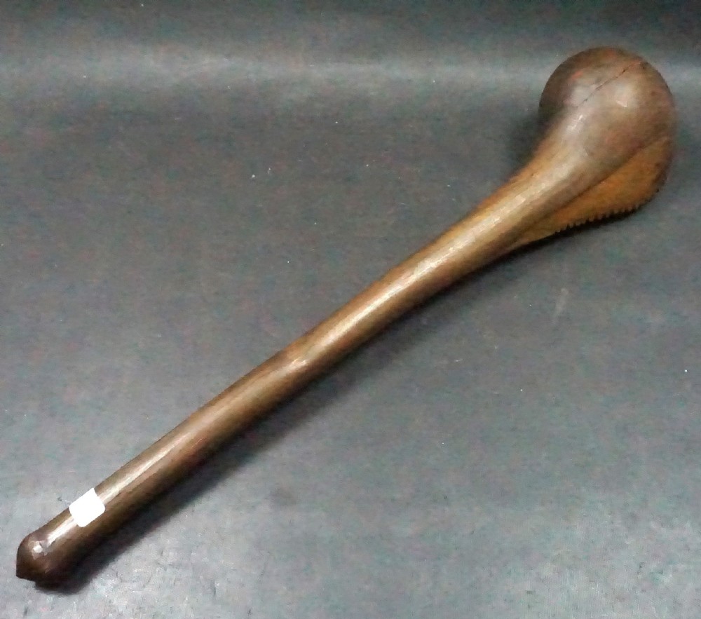 A hand-carved Southern African hardwood knobkerrie club with a smooth tapered shaft and a heavy spherical head.
