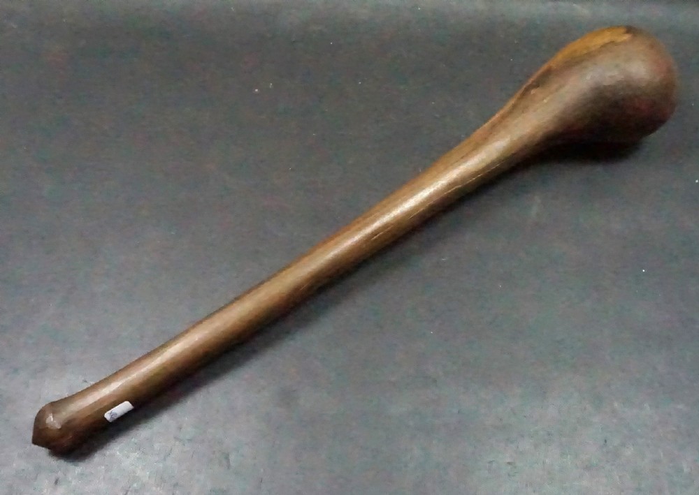 A hand-carved Southern African hardwood knobkerrie club with a smooth tapered shaft and a heavy spherical head. View II