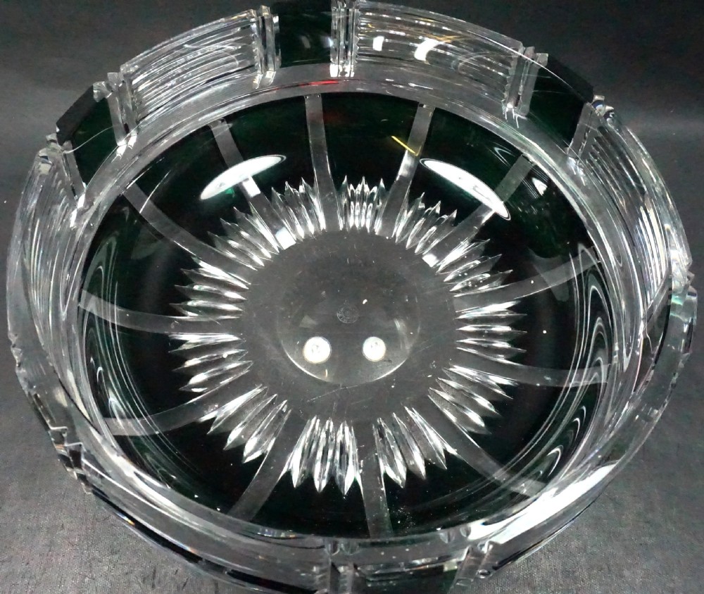 An Art Deco lead crystal bowl featuring dark green overlay glass hand-cut into geometric horizontal lines and rectangular panels. View II