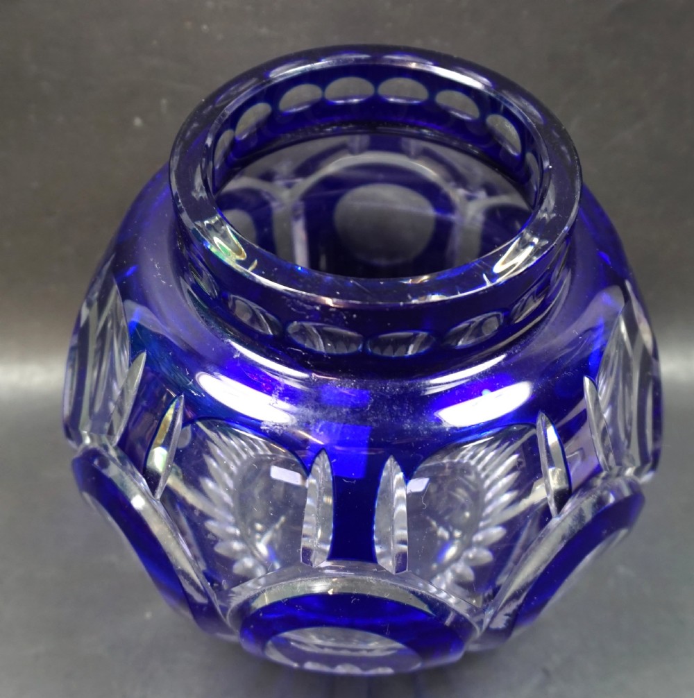 An Art Deco cobalt blue cut-to-clear crystal vase featuring circular lens cuttings and geometric facet detailing. View II