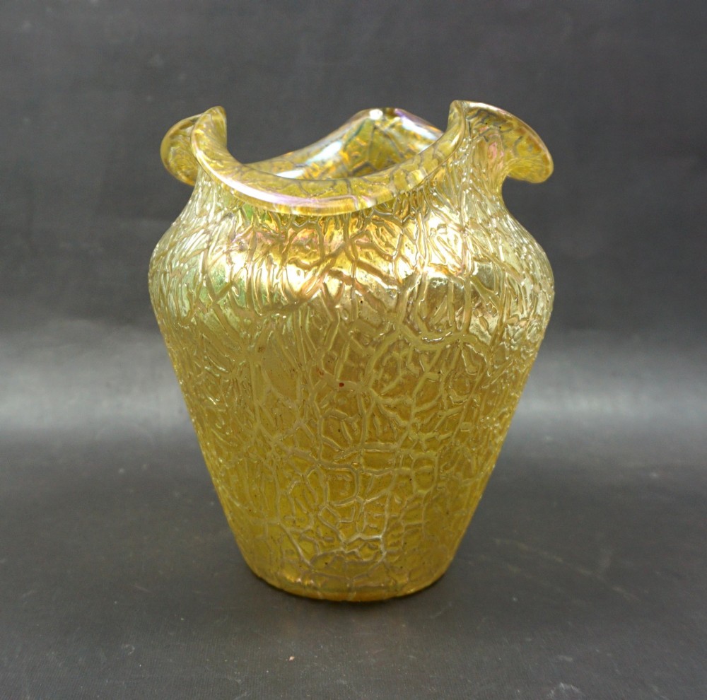 An iridescent golden yellow blown glass vase featuring a webbed surface texture and a crimped rim.