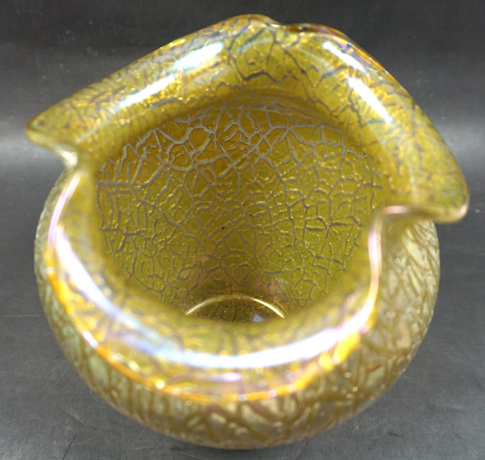 An iridescent golden yellow blown glass vase featuring a webbed surface texture and a crimped rim. View II