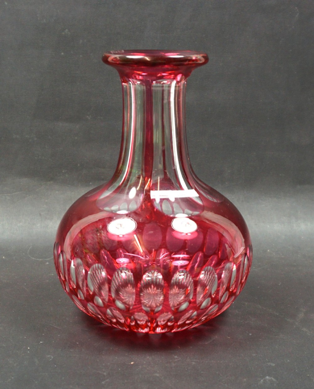 A cranberry over crystal glass carafe, English c.1860
