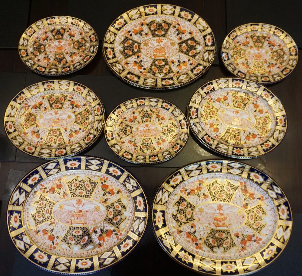 An extensive Victorian Davenport Imari pattern porcelain dinner service comprising numerous plates, serving platters, and covered tureens decorated in cobalt blue, orange, and gilt. View VIII