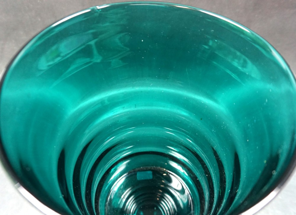 A cylindrical teal glass vase featuring horizontal ribbed banding along its tapered body. View II