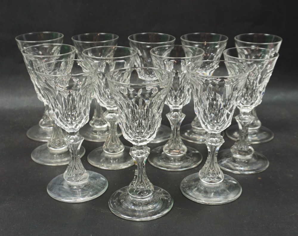 A set of twelve small wine glasses with facet cut stems and bowls, English c.1860