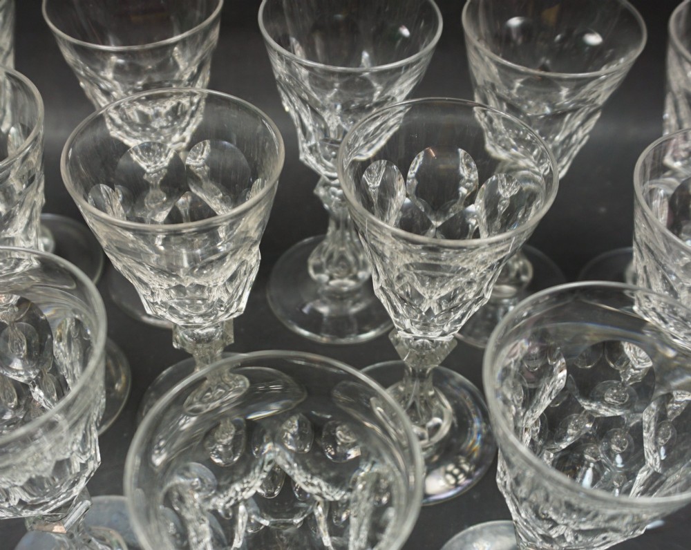 A set of twelve small wine glasses with facet cut stems and bowls, English c.1860 View II