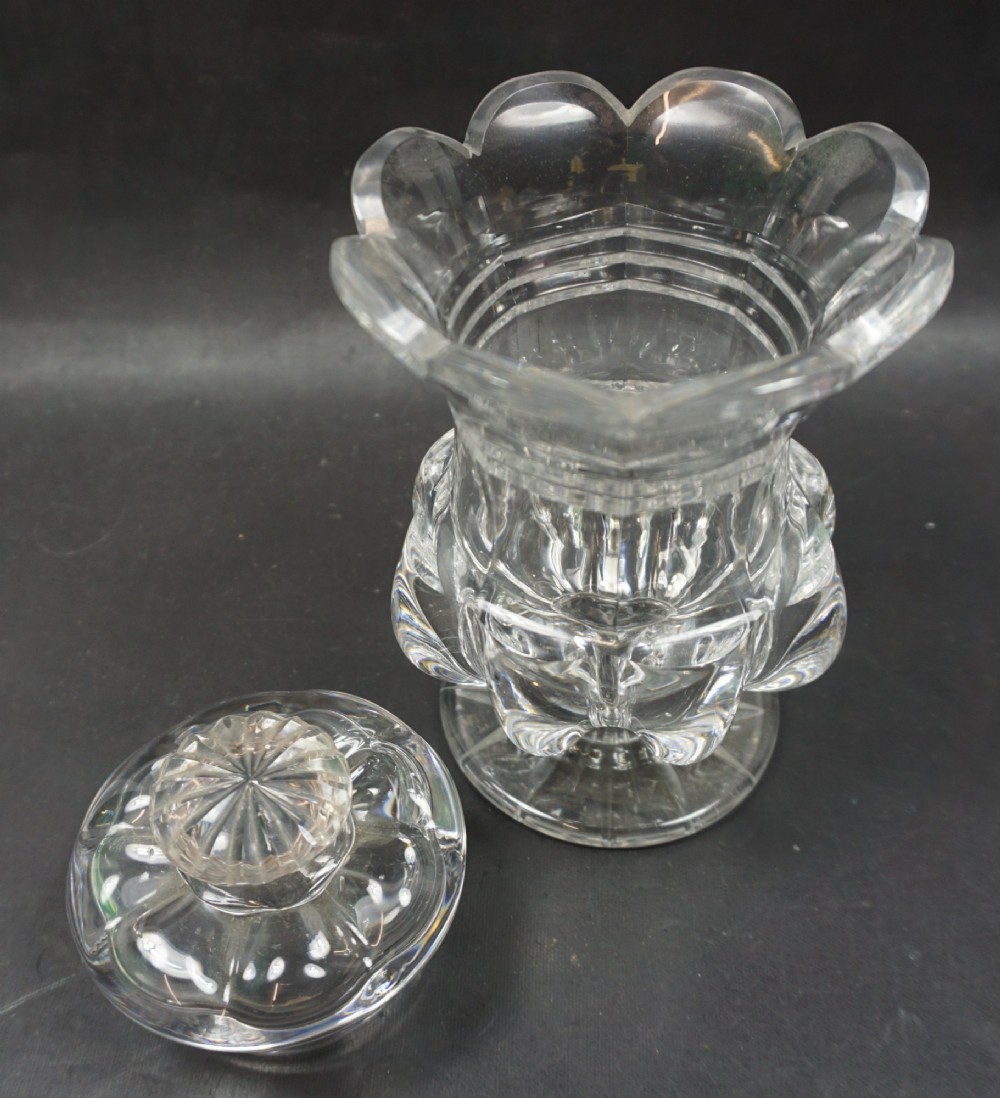 A clear cut crystal preserve jar with a fitted lid, pillar-moulded body, and a star-cut circular foot. View II