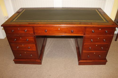 a victorian curl mahogany nine drawer pedestal desk - CATEGORY: ANTIQUE DESKS - DATED 1860