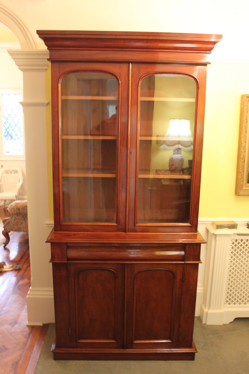 Victorian mahogany two door bookcase on cupboard