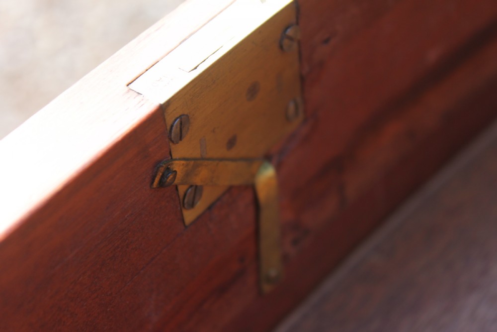 A tall Sheraton Revival satinwood bow front chest featuring six drawers with inlaid crossbanded borders, central brass ring handles, and splayed bracket feet. View X