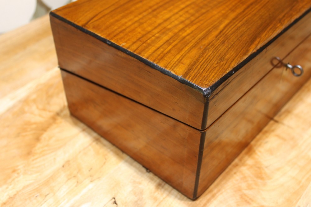 A Victorian walnut writing slope. View IV