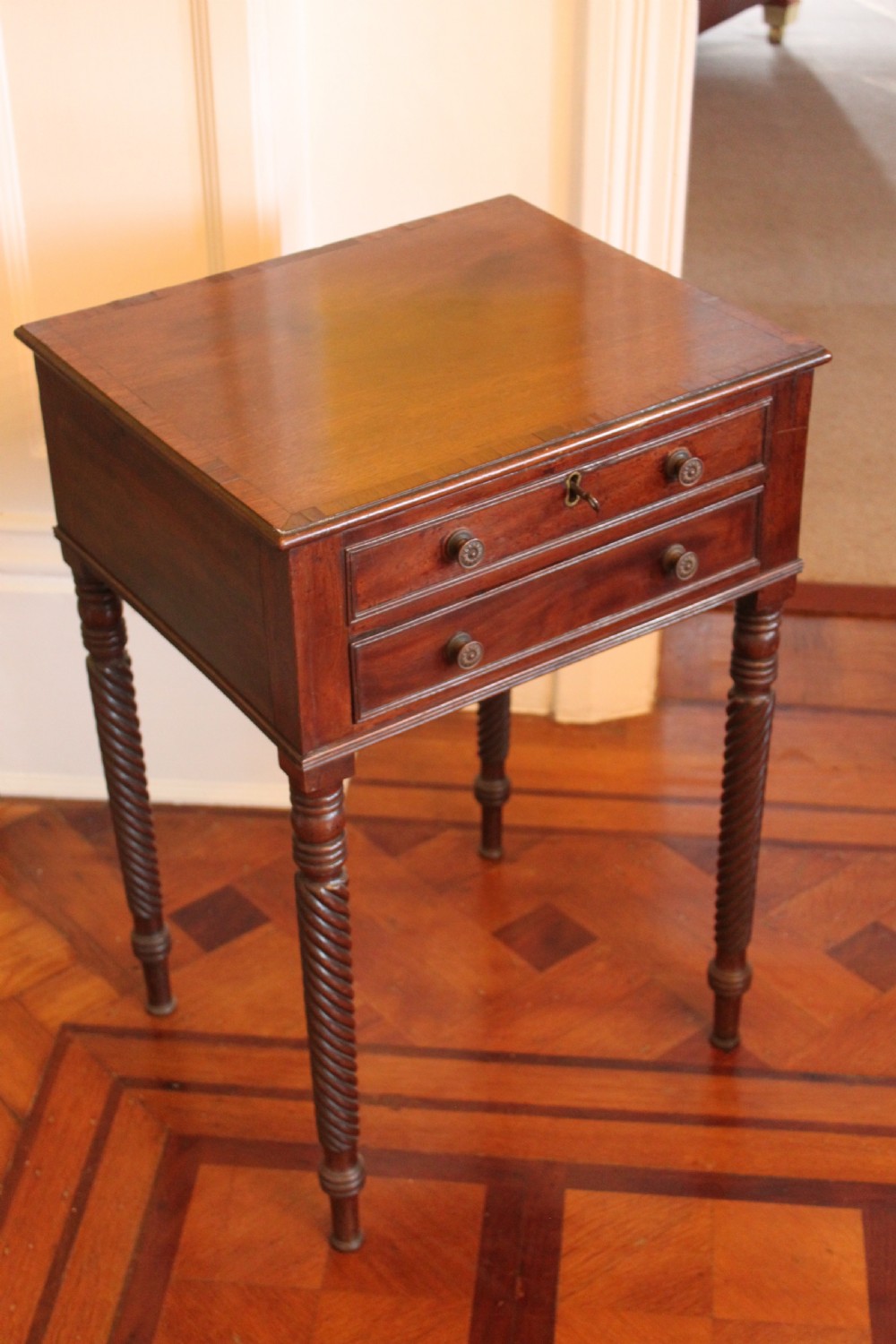 Georgian mahogany and rosewood banded work table